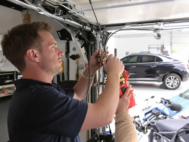 Wolcott Garage Door Repair safety certified technician performing cable replacement in Wolcott