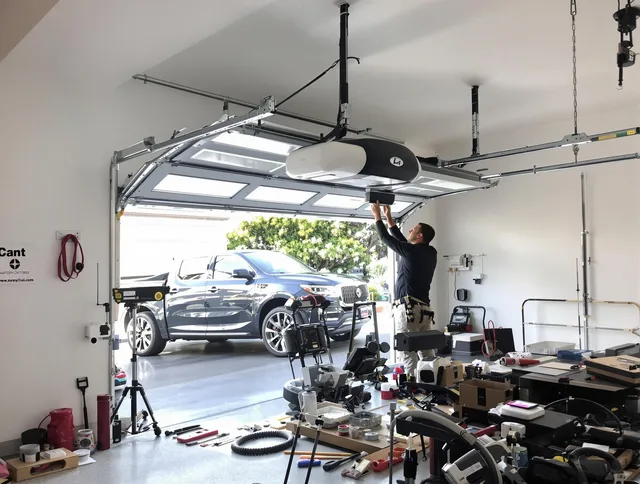 Wolcott Garage Door Repair specialist installing smart garage door opener system in Wolcott home