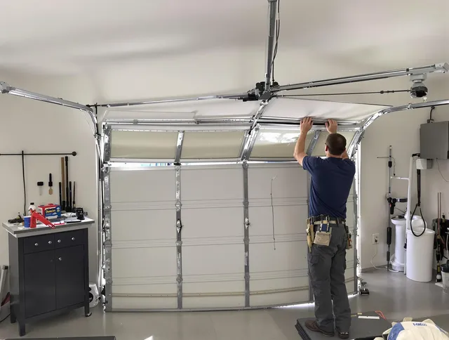 Wolcott Garage Door Repair specialist performing precise section replacement on Wolcott garage door