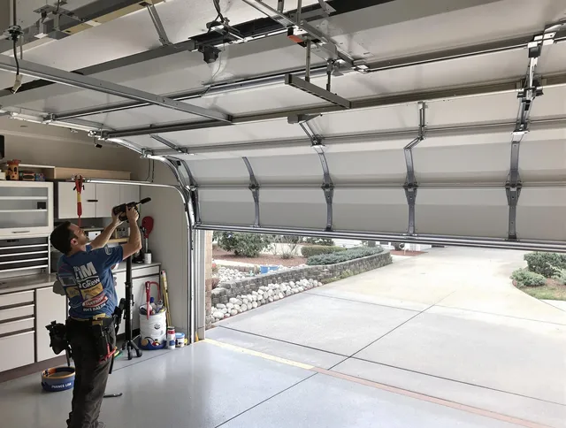 Garage door track repair service by Wolcott Garage Door Repair in Wolcott